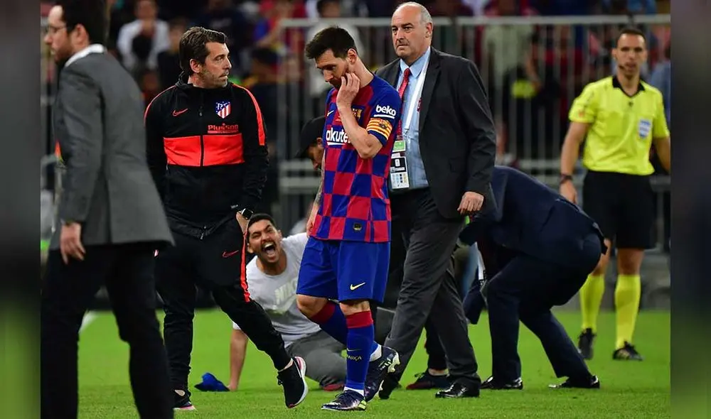 La irrupción del hincha puso en alerta a las personas alrededor de Messi. Foto: AFP.