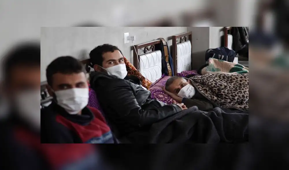Syrians who returned from Turkey rest at a quarantine facility in the countryside of the town of Jisr al-Shughur, west of the mostly rebel-held Syrian province of Idlib, on April 27, 2020 amid the coronavirus COVID-19 pandemic. (Photo by Abdulaziz KETAZ / AFP)