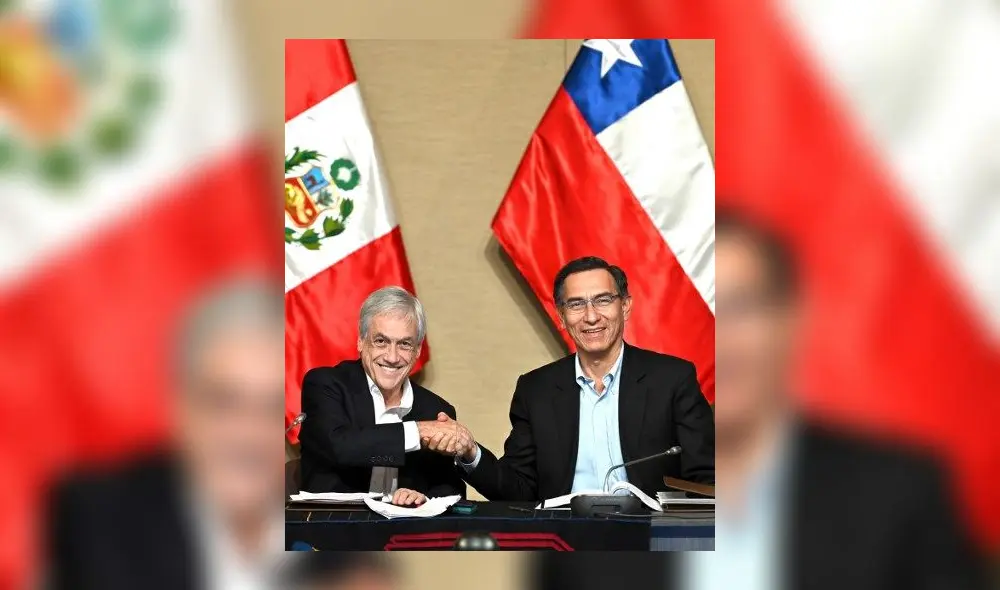 Peruvian President Martin Vizcarra (R) and his Chilean counterpart Sebastian Pinera shake hands after signing documents during a meeting in the framework of the Third Bi-national Peru-Chile Cabinet Meeting in the Peruvian port of Paracas, 260 km south of Lima, on October 10, 2019. (Photo by Cris BOURONCLE / AFP)