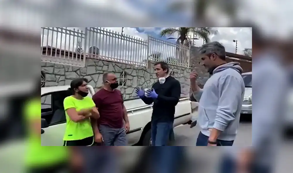 Grab taken from a handout video released by the National Communication Centre showing Venezuelan opposition leader Juan Guaido (2-R) speaking to people queueing for gas in a long line of vehicles in Caracas on June 6, 2020. - Venezuelan opposition leader Juan Guaido reappeared in the street in videos distributed on June 6, 2020 by his team and parliamentary allies, after foreign minister Jorge Arreaza claimed he had taken refuge in the French embassy in Caracas. (Photo by - / Centro de Comunicacion Nacional / AFP) / RESTRICTED TO EDITORIAL USE - MANDATORY CREDIT "AFP PHOTO / CENTRO DE COMUNICACION NACIONAL" - NO MARKETING - NO ADVERTISING CAMPAIGNS - DISTRIBUTED AS A SERVICE TO CLIENTS Grab taken from a handout video released by the National Communication Centre showing Venezuelan opposition leader Juan Guaido (2-R) speaking to people queueing for gas in a long line of vehicles in Caracas on June 6, 2020. - Venezuelan opposition leader Juan Guaido reappeared in the street in videos distributed on June 6, 2020 by his team and parliamentary allies, after foreign minister Jorge Arreaza claimed he had taken refuge in the French embassy in Caracas. (Photo by - / Centro de Comunicacion Nacional / AFP) / RESTRICTED TO EDITORIAL USE - MANDATORY CREDIT "AFP PHOTO / CENTRO DE COMUNICACION NACIONAL" - NO MARKETING - NO ADVERTISING CAMPAIGNS - DISTRIBUTED AS A SERVICE TO CLIENTS