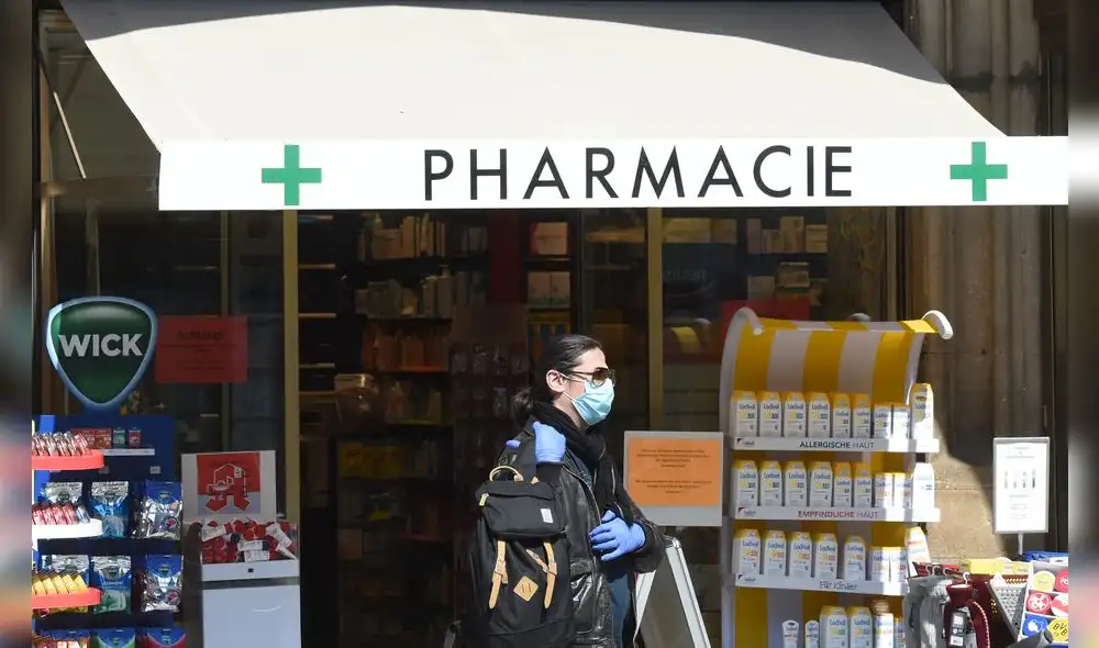 A man wearing a face mask leaves a pharmacy in the city of Munich, southern Germany, on April 9, 2020 as public life in Bavaria has been limited due to the coronavirus COVID-19 pandemic. (Photo by Christof STACHE / AFP) A man wearing a face mask leaves a pharmacy in the city of Munich, southern Germany, on April 9, 2020 as public life in Bavaria has been limited due to the coronavirus COVID-19 pandemic. (Photo by Christof STACHE / AFP)