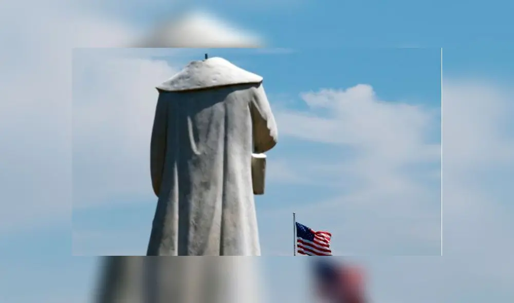 Bandera de Estados Unidos frente a una estatua que representa a Cristóbal Colón. Foto: Tim Bradbury/AFP. Bandera de Estados Unidos frente a una estatua que representa a Cristóbal Colón. Foto: Tim Bradbury/AFP.