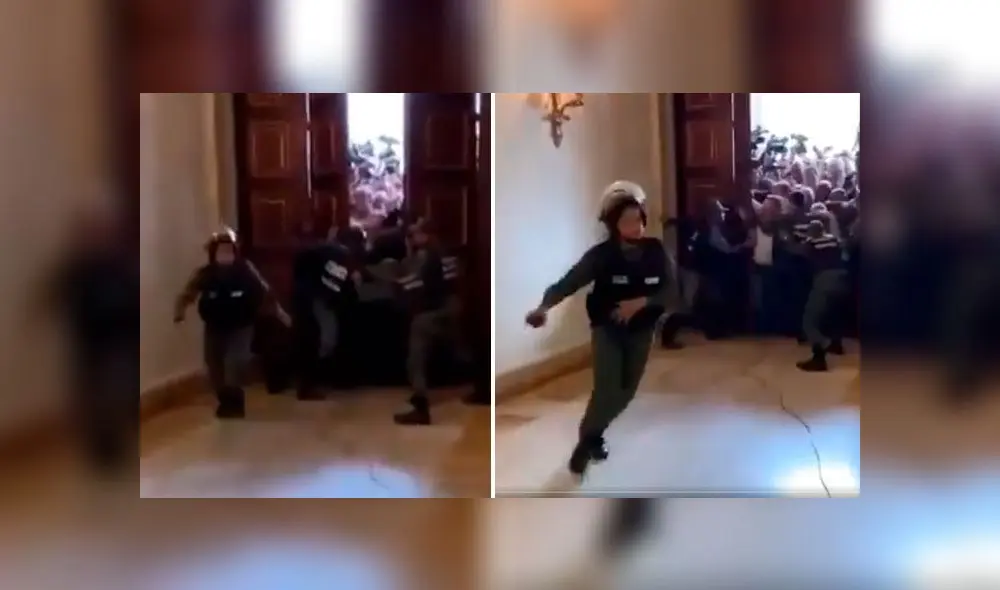 Momento en que policía huye despavorida tras ingreso a la fuerza de Juan Guaidó y diputados. Foto: captura Momento en que policía huye despavorida tras ingreso a la fuerza de Juan Guaidó y diputados. Foto: captura