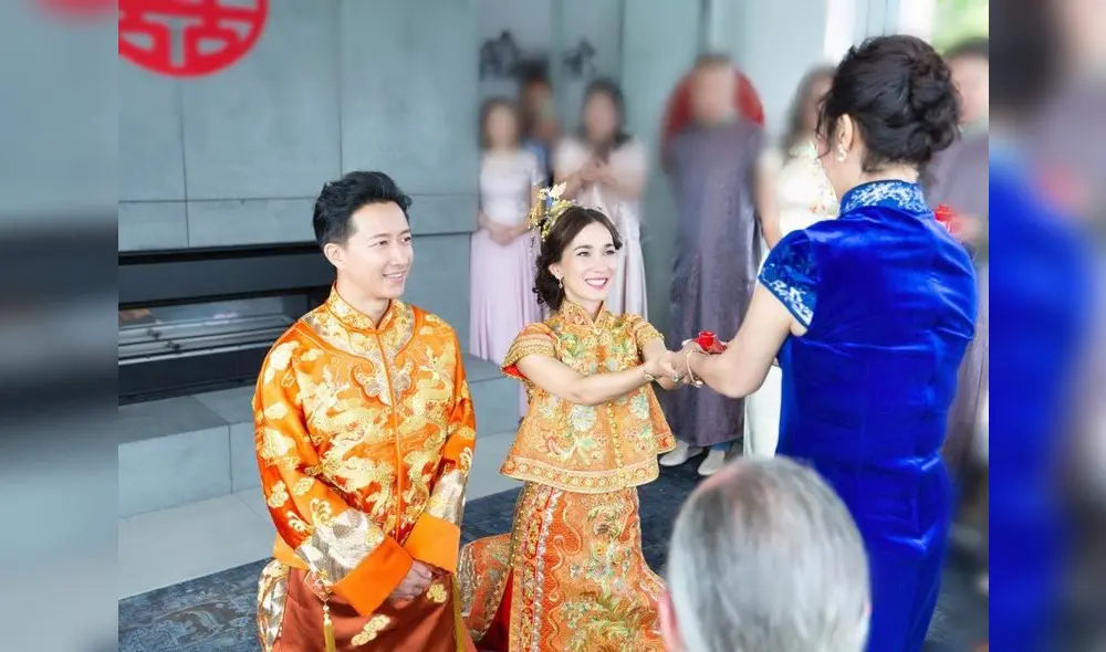 Hangeng y Celina Jade vistiendo trajes tradicionales de China.