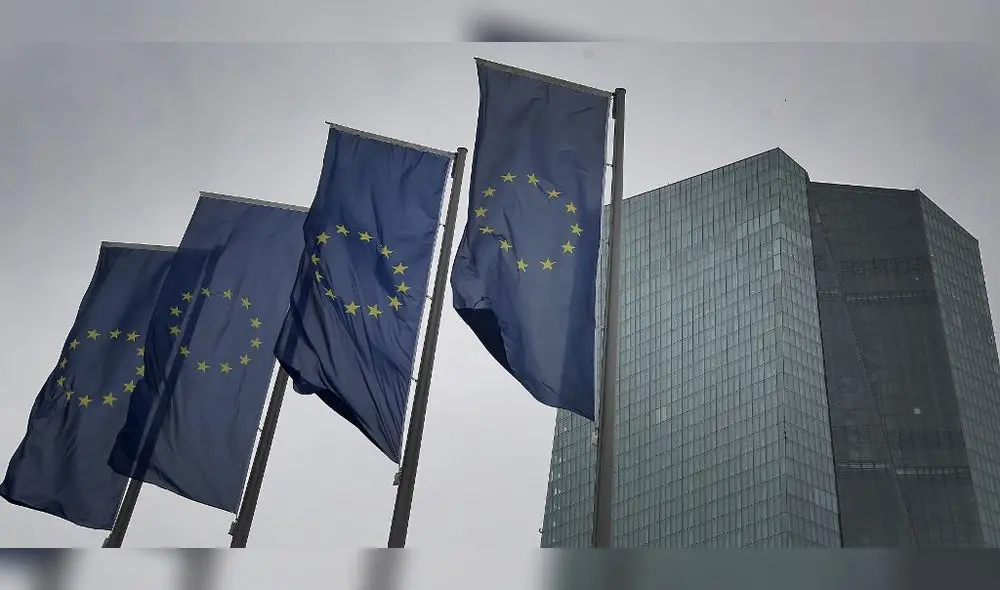 (FILES) In this file photo taken on March 12, 2020 flags of the European Union flutter in front of the headquarters of the European Central Bank (ECB) in Frankfurt am Main, western Germany. - The eurozone economy could shrink by five to 12 percent this year because of the coronavirus crisis, European Central Bank chief Christine Lagarde said on April 30, 2020. (Photo by Daniel ROLAND / AFP)
