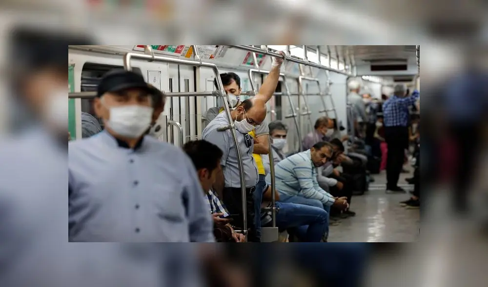 Iranians, mostly wearing face masks, are pictured in a train carriage at a metro station in the capital Tehran on June 10, 2020 amid the coronavirus Covid-19 pandemic crisis. - Nearly one in five Iranians may have been infected with the novel coronavirus since the country's outbreak started in February, a health official said yesterday. The figure represents 18.75 percent of the more than 80 million population of Iran, which on June 9 announced another 74 deaths from the coronavirus. (Photo by STRINGER / AFP)