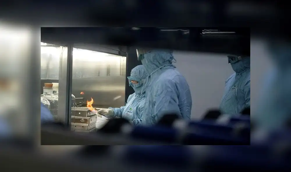 Researchers in protective suits work in a lab at the Yisheng Biopharma company, where researchers are trying to develop a vaccine for the COVID-19 coronavirus, in Shenyang, in China�s northeast Liaoning province, on June 9, 2020. - China has mobilised its army and fast-tracked tests in the global race to find a coronavirus vaccine, and is involved in several of the dozen or so international clinical trials currently under way. (Photo by NOEL CELIS / AFP)