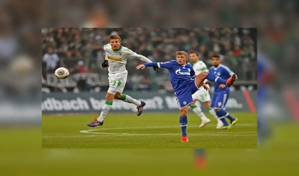 Schalke's midfielder Max Meyer and Moenchengladbach's midfielder Christoph Kramer (L) vie for the ball during the German first division Bundesliga football match Borussia Moenchengladbach vs FC Schalke 04 in Moenchengladbach, western Germany, on December 7, 2013. Moenchengladbach won the match 2-1. AFP PHOTO / NORBERT SCHMIDT

DFL RULES TO LIMIT THE ONLINE USAGE DURING MATCH TIME TO 15 PICTURES PER MATCH. IMAGE SEQUENCES TO SIMULATE VIDEO IS NOT ALLOWED AT ANY TIME. FOR FURTHER QUERIES PLEASE CONTACT THE DFL DIRECTLY AT + 49 69 650050.        (Photo credit should read NORBERT SCHMIDT/AFP/Getty Images)