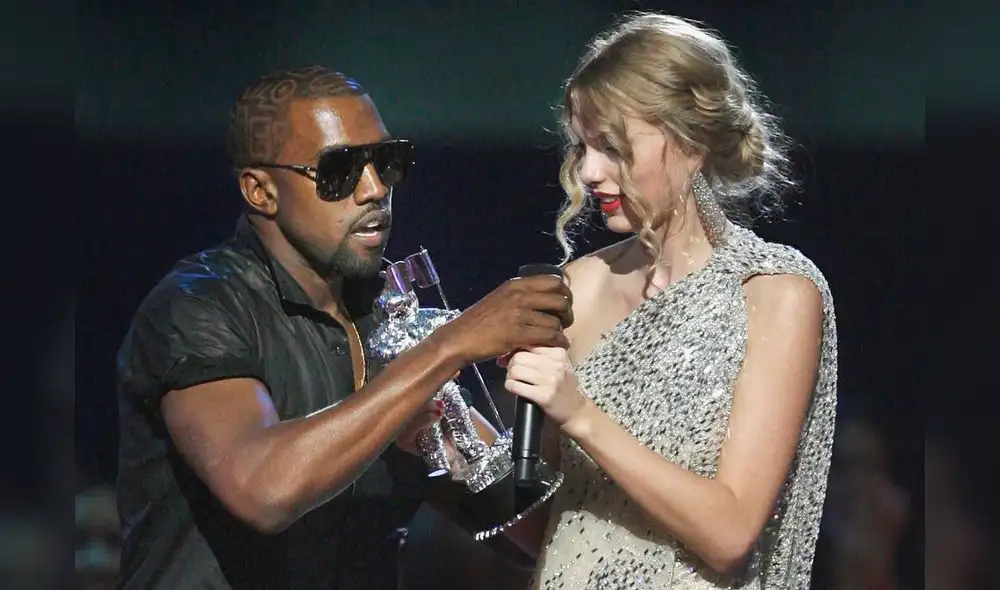 Singer Kanye West takes the microphone from singer Taylor Swift as she accepts the "Best Female Video" award during the MTV Video Music Awards on Sunday, Sept. 13, 2009 in New York.  (AP Photo/Jason DeCrow)