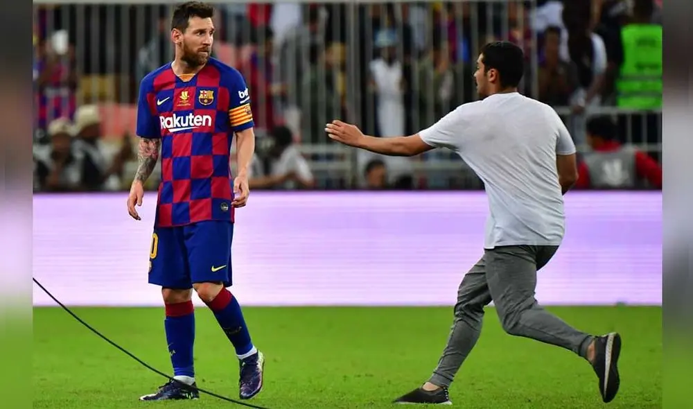 La irrupción del hincha puso en alerta a las personas alrededor de Messi. Foto: AFP.