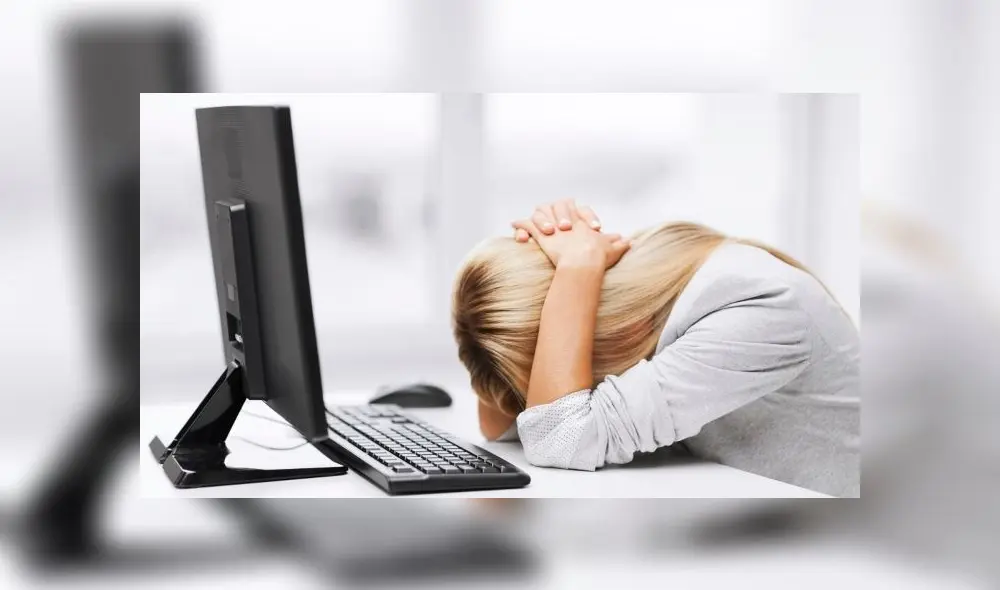 business, office, school and education concept - stressed businesswoman with computer at work