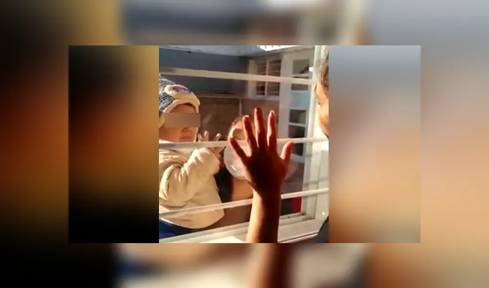 Una mujer con coronavirus debe saludar a su hijo a través de una ventana para no contagiarlo. Foto: Facebook