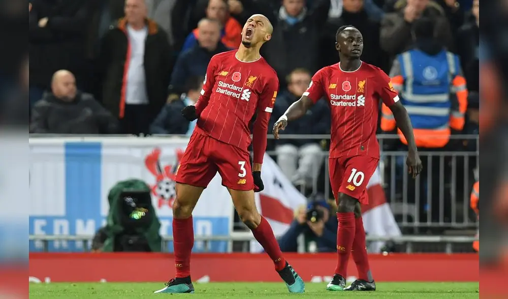 Liverpool's Brazilian midfielder Fabinho (L) celebrates after scoring the opening goal of the English Premier League football match between Liverpool and Manchester City at Anfield in Liverpool, north west England on November 10, 2019. (Photo by Paul ELLIS / AFP) / RESTRICTED TO EDITORIAL USE. No use with unauthorized audio, video, data, fixture lists, club/league logos or 'live' services. Online in-match use limited to 120 images. An additional 40 images may be used in extra time. No video emulation. Social media in-match use limited to 120 images. An additional 40 images may be used in extra time. No use in betting publications, games or single club/league/player publications. / Liverpool's Brazilian midfielder Fabinho (L) celebrates after scoring the opening goal of the English Premier League football match between Liverpool and Manchester City at Anfield in Liverpool, north west England on November 10, 2019. (Photo by Paul ELLIS / AFP) / RESTRICTED TO EDITORIAL USE. No use with unauthorized audio, video, data, fixture lists, club/league logos or 'live' services. Online in-match use limited to 120 images. An additional 40 images may be used in extra time. No video emulation. Social media in-match use limited to 120 images. An additional 40 images may be used in extra time. No use in betting publications, games or single club/league/player publications. /