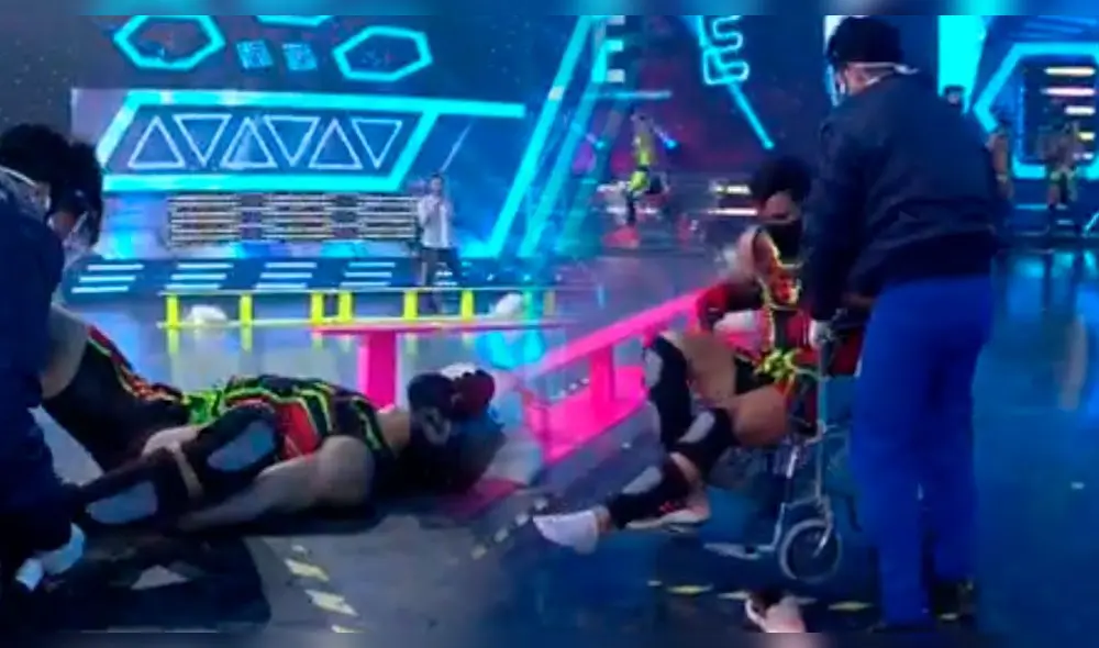 Said Palao se resbaló durante competencia. Médicos lo atendieron y los trasladaron en silla de ruedas. Foto: captura América TV