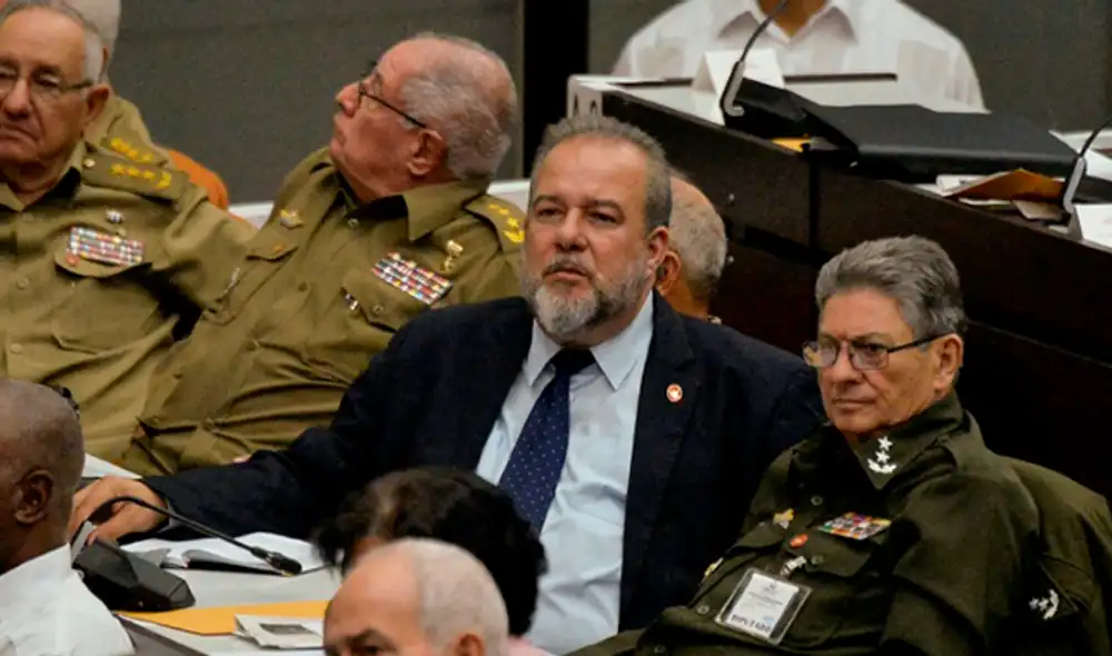 El nuevo primer ministro cubano Manuel Marrero (C), asiste a la clausura del cuarto período ordinario de la Asamblea Nacional en el Palacio de Convenciones de La Habana, el 21 de diciembre de 2019 El nuevo primer ministro cubano Manuel Marrero (C), asiste a la clausura del cuarto período ordinario de la Asamblea Nacional en el Palacio de Convenciones de La Habana, el 21 de diciembre de 2019