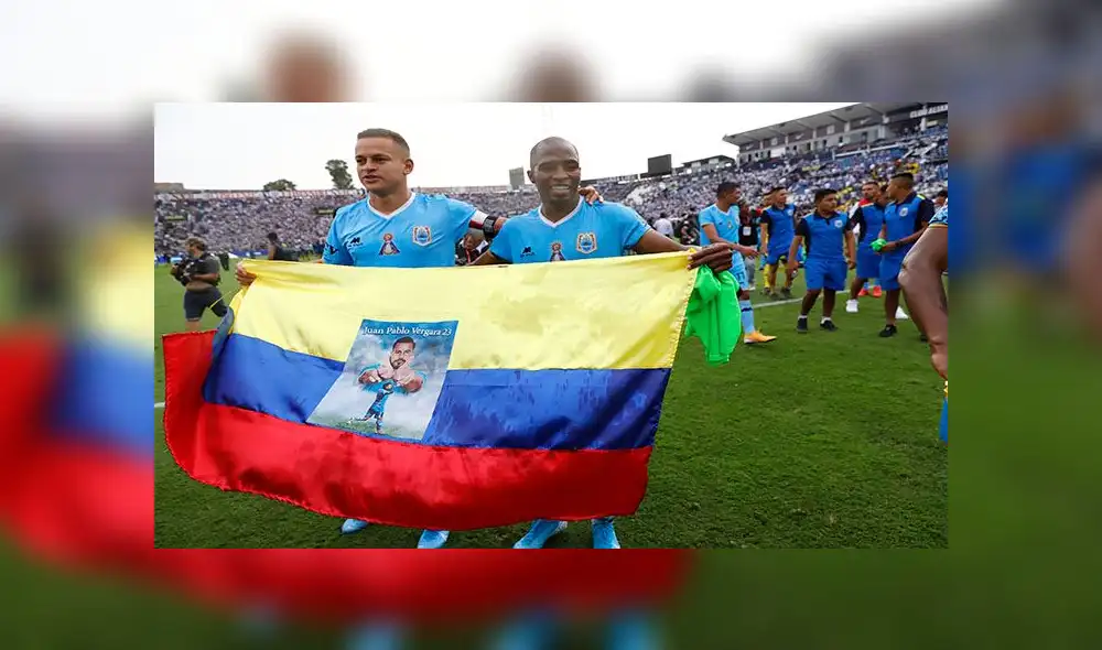 Millán y Leudo con la bandera de su natal Colombia luego de ganar el Campeonato Nacional en Matute