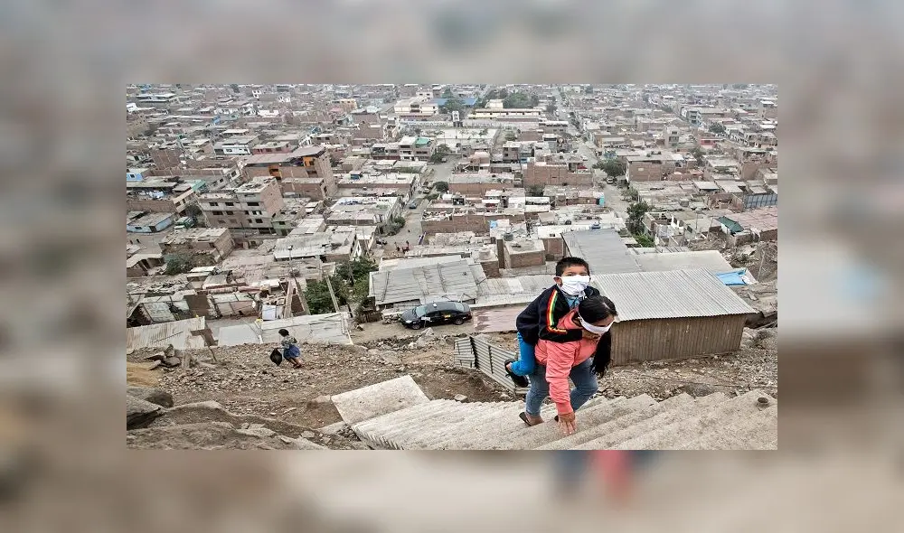 Peruvian Marlith Mori returns to her home on the heights of the Vista Alegre shantytown of the Comas district in the outskirts of Lima, carrying her impaired son Jeyson who attends daily therapy at a nearby medical facility, on May 21, 2020. - Mori lives in an area where residents' low budgets force them to break mandatory isolation to find daily means of support. Peru crossed the 100 thousand confirmed cases and statistics stand as of May 21 on 108,769 infected, of which 43,587 have recovered and 3,148 have died since the virus was first detected in Peru on March 6. (Photo by Geraldo Caso BIZAMA / AFP) Peruvian Marlith Mori returns to her home on the heights of the Vista Alegre shantytown of the Comas district in the outskirts of Lima, carrying her impaired son Jeyson who attends daily therapy at a nearby medical facility, on May 21, 2020. - Mori lives in an area where residents' low budgets force them to break mandatory isolation to find daily means of support. Peru crossed the 100 thousand confirmed cases and statistics stand as of May 21 on 108,769 infected, of which 43,587 have recovered and 3,148 have died since the virus was first detected in Peru on March 6. (Photo by Geraldo Caso BIZAMA / AFP)