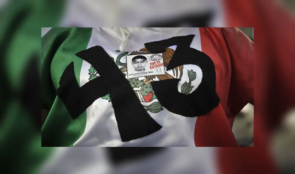 (FILES) In this file photo taken on April 26, 2016 a woman joins the parents of 43 missing students from Ayotzinapa teachers school during a march in Mexico City, 18 months after their disappearance. - Mexico has arrested a man linked to the suspected massacre of 43 students who went missing in 2014 in Guerrero state, a government source told AFP on June 29, 2020. The students' disappearance became a symbol of the gruesome violence blighting the country, as well as -- many claimed -- the murky links between powerful drug cartels and corrupt officials. (Photo by Yuri CORTEZ / AFP)