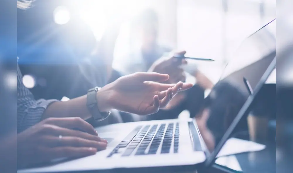 Business meeting concept.Closeup view of business people working with mobile computer at modern office.Analyze business plans, using laptop.Blurred background.Cropped Business meeting concept.Closeup view of business people working with mobile computer at modern office.Analyze business plans, using laptop.Blurred background.Cropped