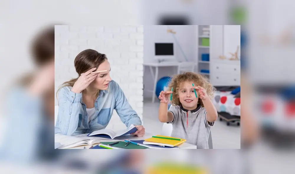 Impatient mother doing homework with distracted son