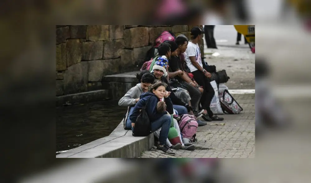 Venezuelan migrants rest at a park in Bucaramanga, Colombia, on December 17, 2019. - Venezuelan migrants in Colombia undertake a round trip to their country with the desire to spend Christmas at home. (Photo by Juan BARRETO / AFP) Venezuelan migrants rest at a park in Bucaramanga, Colombia, on December 17, 2019. - Venezuelan migrants in Colombia undertake a round trip to their country with the desire to spend Christmas at home. (Photo by Juan BARRETO / AFP)