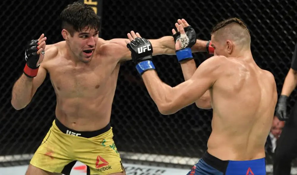 Luque (amarillo) venció a Price (azul) luego de que uno de sus golpes causara gran daño en el rostro de este. Foto: Jeff Bottari/Zuffa LLC.