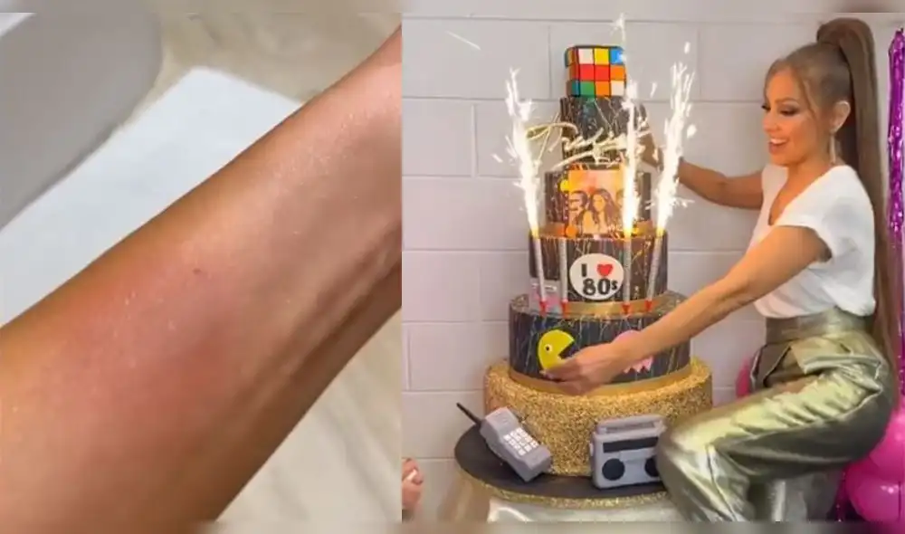 En las imágenes se ve que una de las velas se desprende del pastel y cae sobre el antebrazo de Thalía. (Foto: Captura)