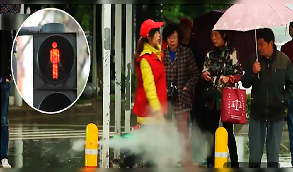 China: "Bañan" a imprudentes peatones que intentan cruzar en rojo [VIDEO]