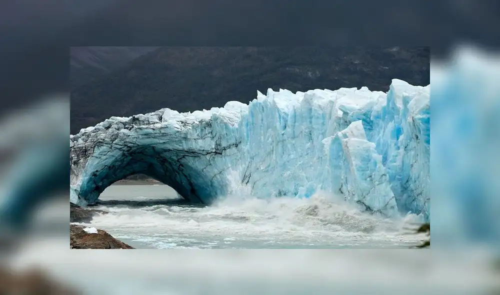 Chuncks of ice come off from the Perito Moreno Glacier, at Los Glaciares National Park, near El Calafate in the Argentine province of Santa Cruz, on March 11, 2018. - An arch of ice formed at the tip of the Perito Moreno, between the glacier and the shore of Argentino lake, started collapsing into the water on Saturday, a natural display that happens just once every several years. Such arches form roughly every two to four years, when the glacier forms a dam of ice that cuts off the flow of water around it into the lake -- until the water breaks through, opening up a steadily wider tunnel that eventually becomes a narrow arch... and then collapses. (Photo by Walter Diaz / AFP)