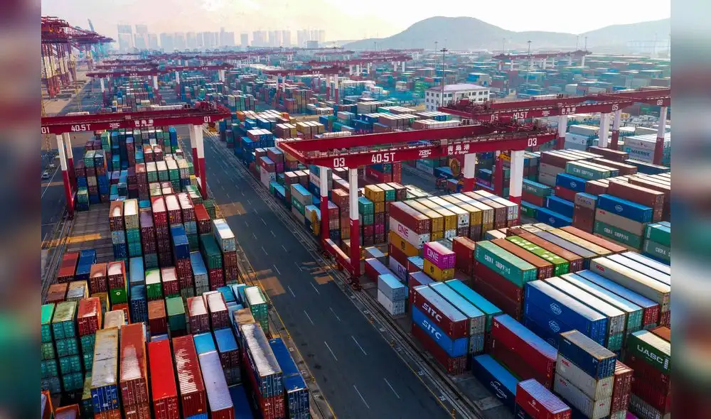 Containers are seen stacked at a port in Qingdao in China's eastern Shandong province on January 14, 2020. - China's trade surplus with the United States narrowed last year as the world's two biggest economies exchanged punitive tariffs in a bruising trade war, official data showed on January 14, on the eve of a deal to ease tensions. (Photo by STR / AFP) Containers are seen stacked at a port in Qingdao in China's eastern Shandong province on January 14, 2020. - China's trade surplus with the United States narrowed last year as the world's two biggest economies exchanged punitive tariffs in a bruising trade war, official data showed on January 14, on the eve of a deal to ease tensions. (Photo by STR / AFP)
