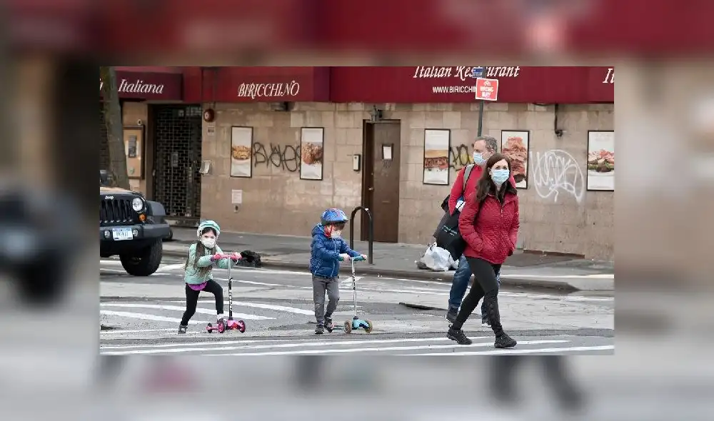 A mother holds his son next to Yangtze River in Wuhan, in China�s central Hubei province on May 12, 2020. - Wuhan plans to conduct coronavirus tests on the Chinese city's entire population after new cases emerged for the first time in weeks in the cradle of the global pandemic, state media reported on May 12. (Photo by Hector RETAMAL / AFP) A mother holds his son next to Yangtze River in Wuhan, in China�s central Hubei province on May 12, 2020. - Wuhan plans to conduct coronavirus tests on the Chinese city's entire population after new cases emerged for the first time in weeks in the cradle of the global pandemic, state media reported on May 12. (Photo by Hector RETAMAL / AFP)