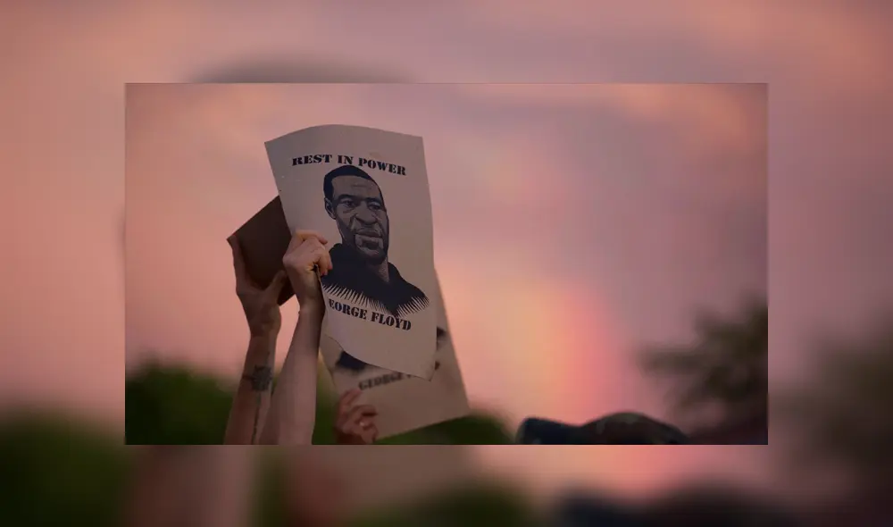 Un manifestante sostiene un cartel con una imagen de George Floyd durante las protestas en Mineápolis, Minnesota, el 27 de mayo. | Foto: Christine T. Nguyen /AP