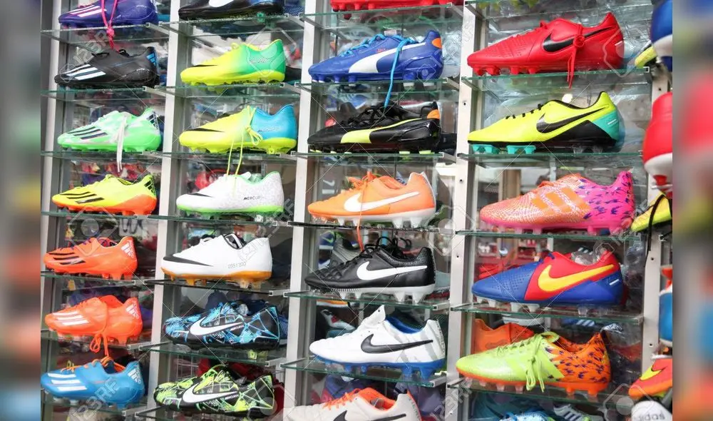 Football shoes of renowned brands (Nike) sold at sports shop in Pattaya market.