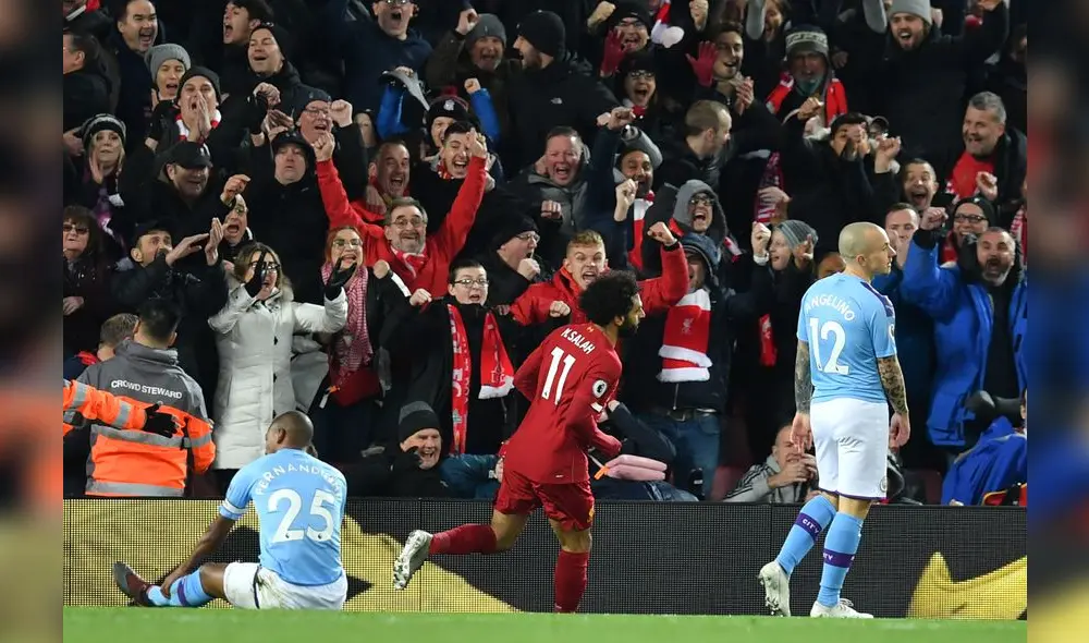 Liverpool's Brazilian midfielder Fabinho (L) celebrates after scoring the opening goal of the English Premier League football match between Liverpool and Manchester City at Anfield in Liverpool, north west England on November 10, 2019. (Photo by Paul ELLIS / AFP) / RESTRICTED TO EDITORIAL USE. No use with unauthorized audio, video, data, fixture lists, club/league logos or 'live' services. Online in-match use limited to 120 images. An additional 40 images may be used in extra time. No video emulation. Social media in-match use limited to 120 images. An additional 40 images may be used in extra time. No use in betting publications, games or single club/league/player publications. / Liverpool's Brazilian midfielder Fabinho (L) celebrates after scoring the opening goal of the English Premier League football match between Liverpool and Manchester City at Anfield in Liverpool, north west England on November 10, 2019. (Photo by Paul ELLIS / AFP) / RESTRICTED TO EDITORIAL USE. No use with unauthorized audio, video, data, fixture lists, club/league logos or 'live' services. Online in-match use limited to 120 images. An additional 40 images may be used in extra time. No video emulation. Social media in-match use limited to 120 images. An additional 40 images may be used in extra time. No use in betting publications, games or single club/league/player publications. /