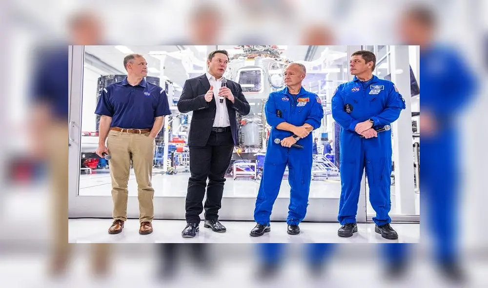 SpaceX founder Elon Musk (2nd L) addresses the media alongside NASA Administrator Jim Bridenstine (L), and astronauts Doug Hurley (2nd R) and Bob Behnken (R), during a press conference announcing new developments of the Crew Dragon reusable spacecraft, at SpaceX headquarters in Hawthorne, California on October 10, 2019. (Photo by Philip Pacheco / AFP)