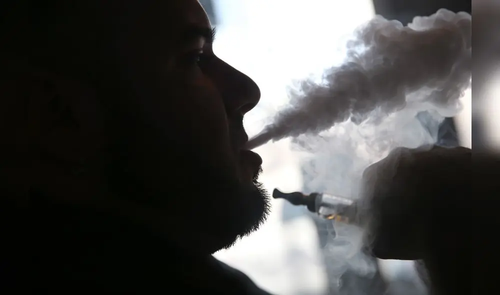 MIAMI, FL - APRIL 24: Michael Crespo, a salesman, waits for customers as he enjoys an electronic cigarette at the Vapor Shark store on April 24, 2014 in Miami, Florida. Brandon Leidel, CEO, Director of Operations Vapor Shark, said he welcomes the annoucement by the Food and Drug Administration that they are proposing the first federal regulations on electronic cigarettes, which would ban sales of the popular devices to anyone under 18 and require makers to gain FDA approval for their products. Joe Raedle/Getty Images/AFP MIAMI, FL - APRIL 24: Michael Crespo, a salesman, waits for customers as he enjoys an electronic cigarette at the Vapor Shark store on April 24, 2014 in Miami, Florida. Brandon Leidel, CEO, Director of Operations Vapor Shark, said he welcomes the annoucement by the Food and Drug Administration that they are proposing the first federal regulations on electronic cigarettes, which would ban sales of the popular devices to anyone under 18 and require makers to gain FDA approval for their products. Joe Raedle/Getty Images/AFP