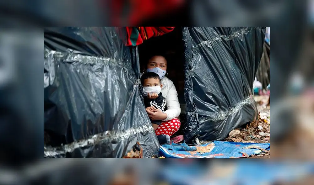 Ciudadanos venezolanos en un campamento improvisado montado en el separador de la autopista norte, en Bogotá (Colombia). EFE Ciudadanos venezolanos en un campamento improvisado montado en el separador de la autopista norte, en Bogotá (Colombia). EFE
