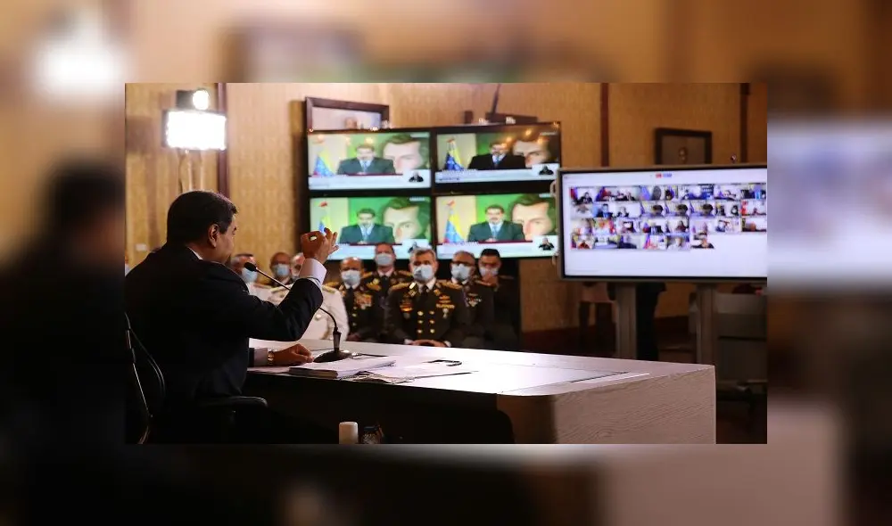 Handout picture released by the Venezuelan Presidency showing Venezuelan President Nicolas Maduro speaking during a video conference meeting with international media correspondents, at Miraflores Presidential Palace in Caracas, on May 6, 2020. - Venezuela is to try two Americans allegedly captured during a failed sea attack by mercenaries, President Nicolas Maduro said on Wednesday. (Photo by Marcelo Garcia / Venezuelan Presidency / AFP) / RESTRICTED TO EDITORIAL USE - MANDATORY CREDIT "AFP PHOTO / VENEZUELAN PRESIDENCY / MARCELO GARCIA " - NO MARKETING - NO ADVERTISING CAMPAIGNS - DISTRIBUTED AS A SERVICE TO CLIENTS