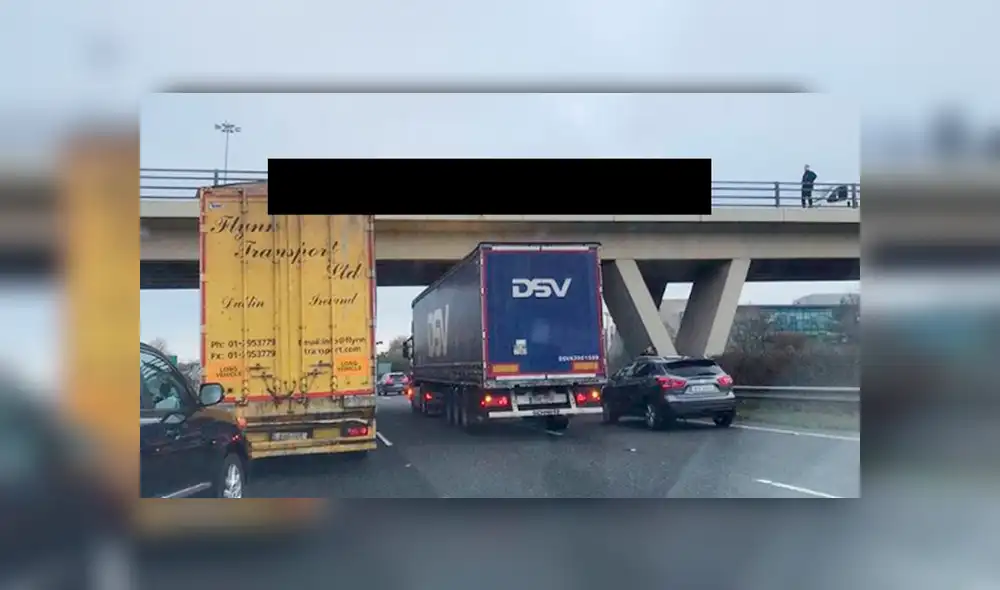Conductor salva a mujer que colgaba de un puente al estacionar su camión debajo de ella