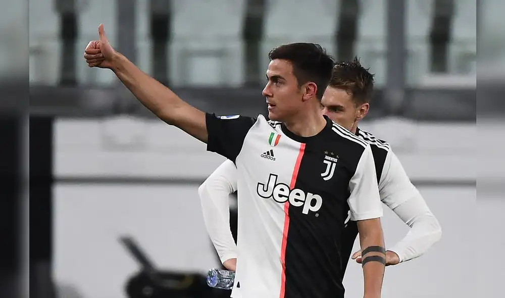 Juventus' Argentine forward Paulo Dybala celebrates after scoring their second goal during the Italian Serie A football match Juventus vs Inter Milan, at the Juventus stadium in Turin on March 8, 2020. - The match is played behind closed doors due to the novel coronavirus outbreak. (Photo by Vincenzo PINTO / AFP)