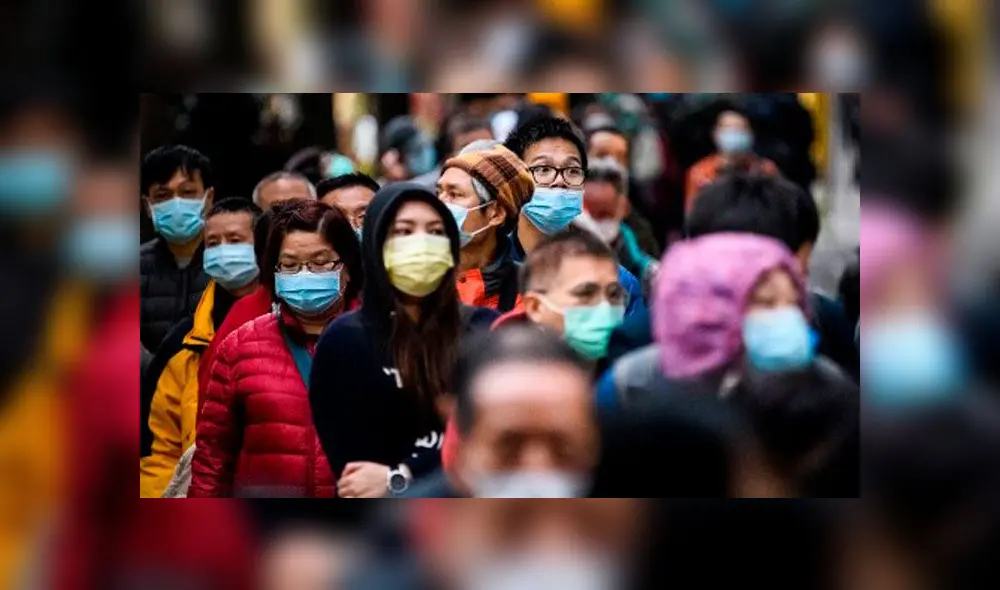 Las personas que usan mascarillas como medida preventiva después de un brote de coronavirus que comenzó en la ciudad china de Wuhan. Foto: AFP. Las personas que usan mascarillas como medida preventiva después de un brote de coronavirus que comenzó en la ciudad china de Wuhan. Foto: AFP.
