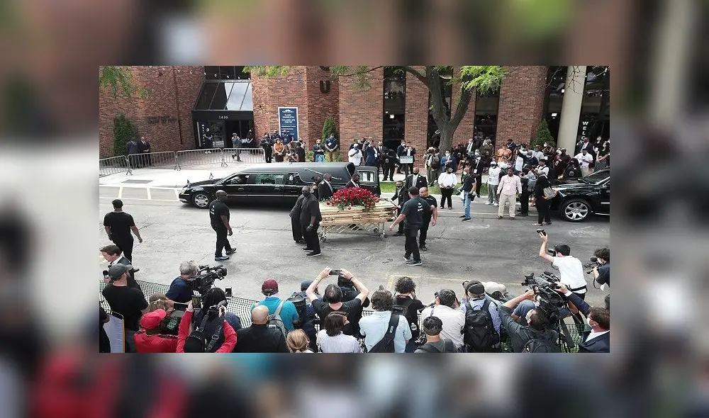 MINNEAPOLIS, MINNESOTA - JUNE 04: The remains of George Floyd are carried from Trask Worship Center at North Central University following a memorial service on June 4, 2020 in Minneapolis, Minnesota. Floyd died while in police custody on May 25, after former Minneapolis police officer Derek Chauvin kneeled on his neck for nine minutes while detaining him. His death has sparked nationwide protests and rioting.   Scott Olson/Getty Images/AFP