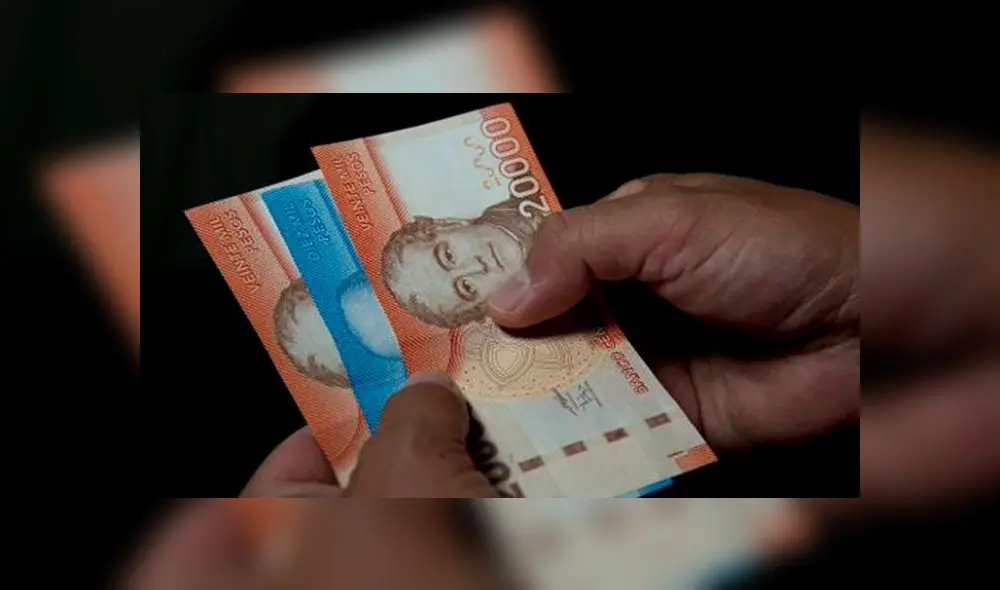 El aumento será percibido por los trabajadores que ganan los menores sueldos. Foto: AFP