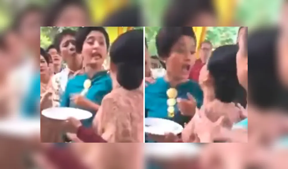 Las mujeres estaban haciendo cola para servirse el buffet en la fiesta de una boda. Foto: captura Las mujeres estaban haciendo cola para servirse el buffet en la fiesta de una boda. Foto: captura