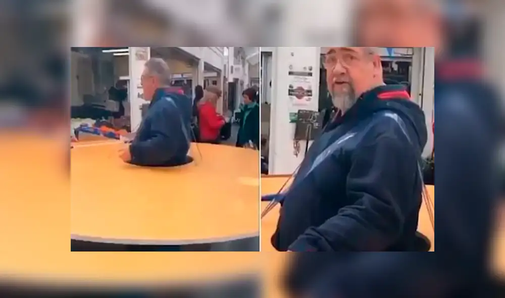 Hombre usa cartón gigante para mantenerse alejado de la gente por coronavirus [VIDEO] 