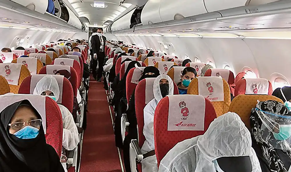 distancia social covid-19 avion