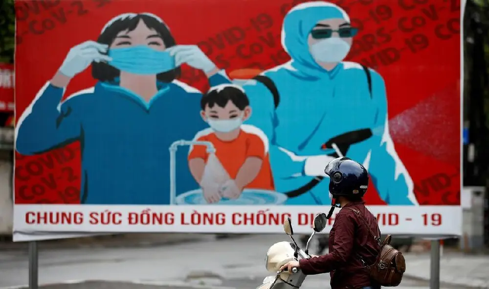 Propaganda oficial en Hanoi para que la población utilice, de manera obligatoria, los tapabocas. Foto: EFE Propaganda oficial en Hanoi para que la población utilice, de manera obligatoria, los tapabocas. Foto: EFE
