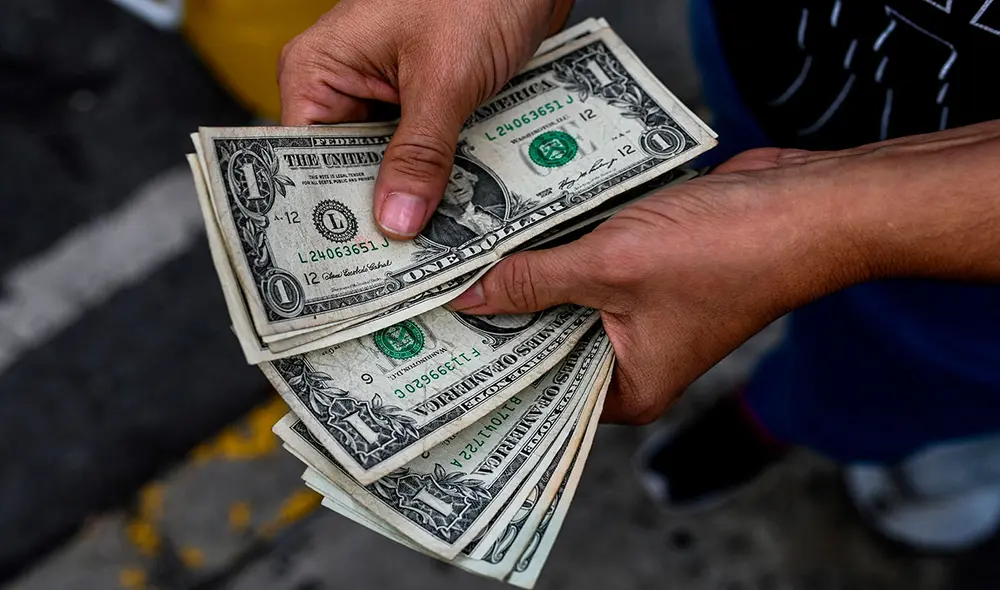 El dólar del Banco Central de Venezuela es el oficial en la nación petrolera, informado en respuesta al mercado paralelo de DolarToday y Monitor Dólar. Foto: AFP El dólar del Banco Central de Venezuela es el oficial en la nación petrolera, informado en respuesta al mercado paralelo de DolarToday y Monitor Dólar. Foto: AFP