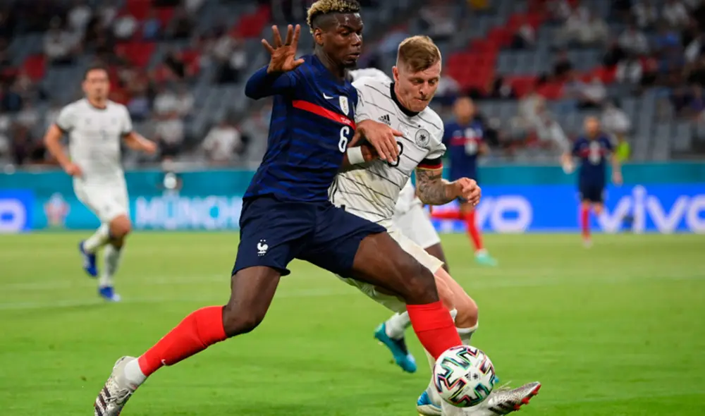 Paul Pogba disputando el balón con Toni Kroos durante el Francia-Alemania por la Eurocopa 2021. Foto: AFP Paul Pogba disputando el balón con Toni Kroos durante el Francia-Alemania por la Eurocopa 2021. Foto: AFP