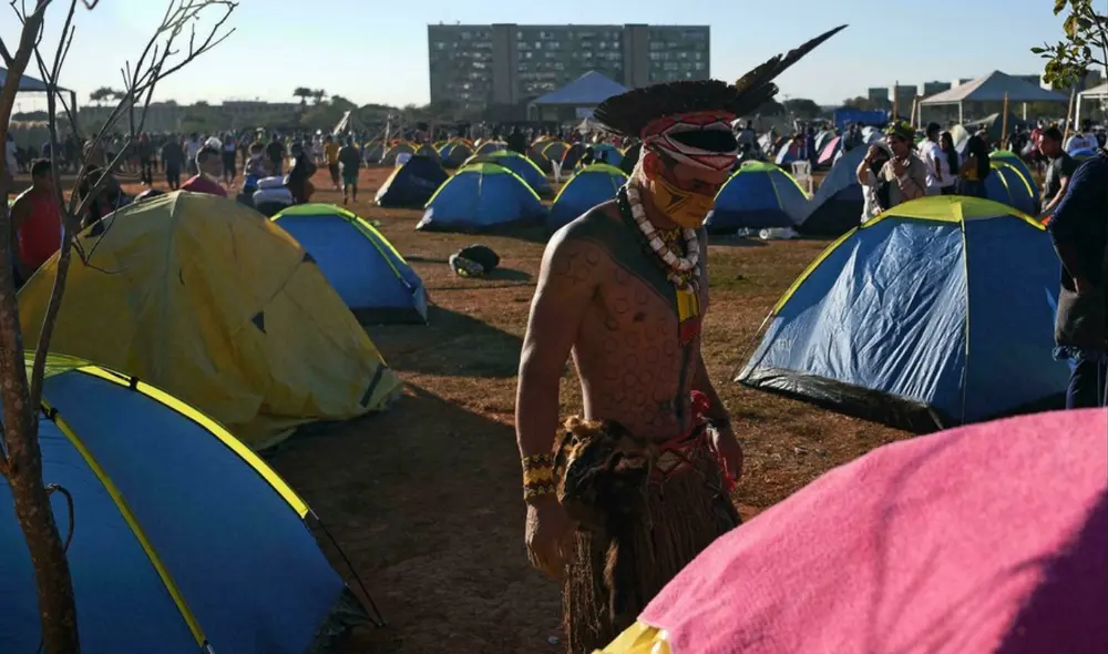 En el Día Internacional de los Pueblos Indígenas, que se conmemora cada 9 de agosto, Bolsonaro fue denunciado ante La Haya por los delitos de genocidio y ecocidio. Foto: Carl de Souza / AFP En el Día Internacional de los Pueblos Indígenas, que se conmemora cada 9 de agosto, Bolsonaro fue denunciado ante La Haya por los delitos de genocidio y ecocidio. Foto: Carl de Souza / AFP